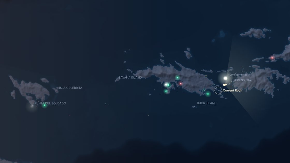 The Virgin Islands at night: St. Thomas, St. John and the BVI in moonlit relief, every navigation light glowing in its colour