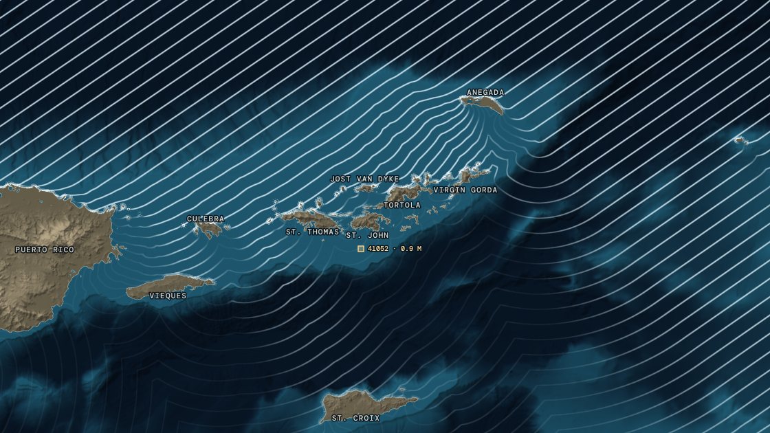 The February 2026 north swell's crests bending round the U.S. and British Virgin Islands over the seabed, the north shores lit by surf