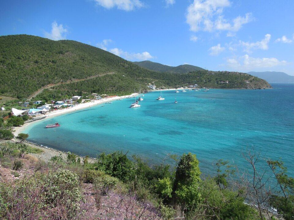 White Bay from the hill at its west end, looking east along the beach to the boats in the bay (December 2019)