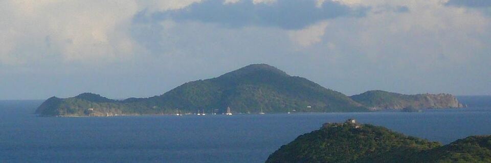 Cooper Island across the Sir Francis Drake Channel from the hills of Tortola, with yachts on the moorings in Manchioneel Bay