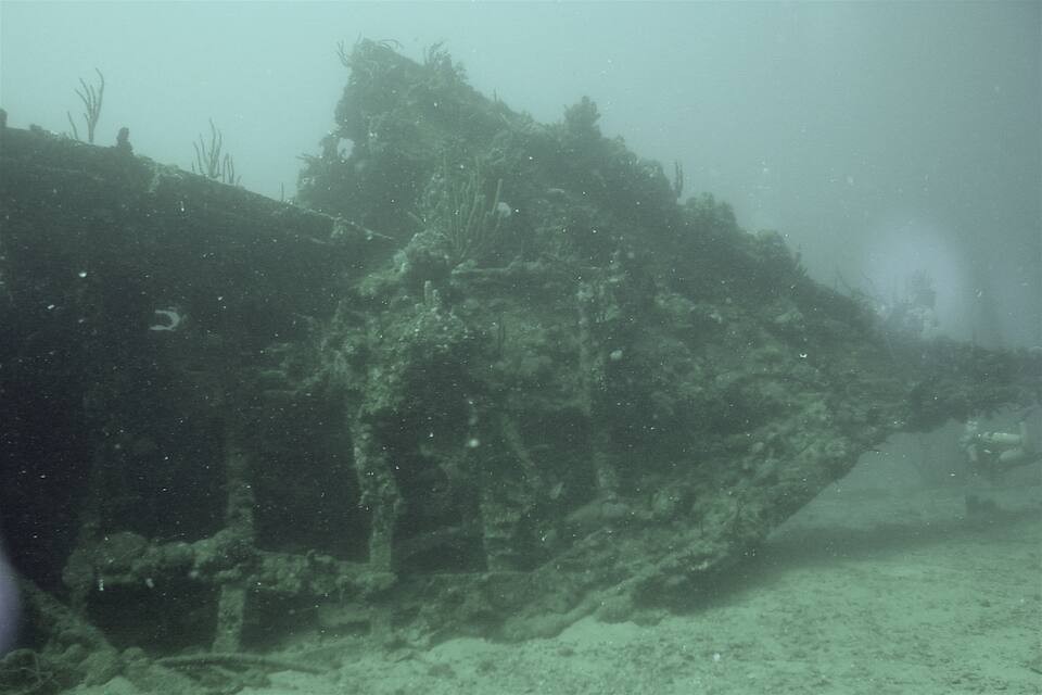 The coral-grown bow section of the RMS Rhone on the sand off Salt Island