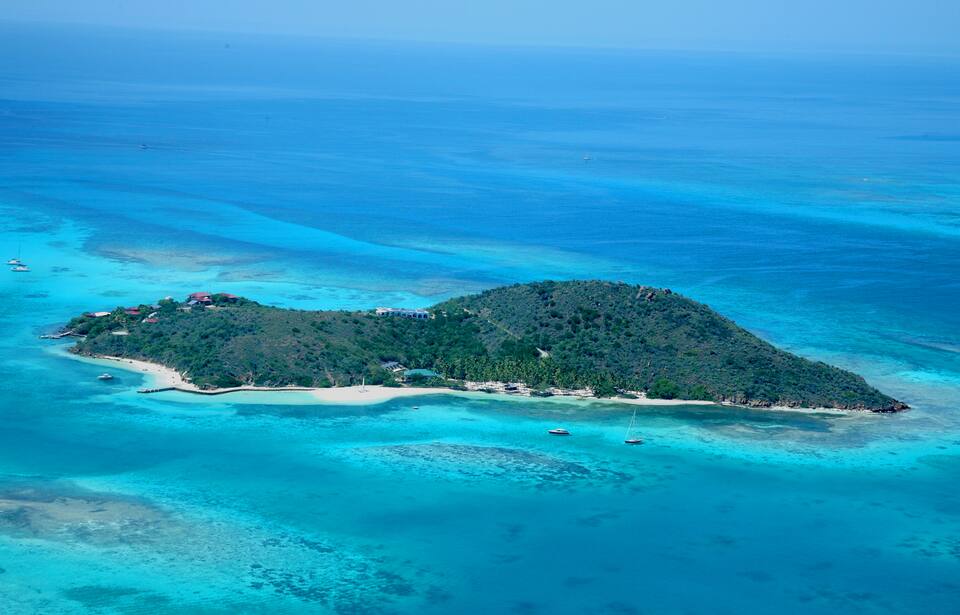 Eustatia Island from the air, its beaches and reef in shallow turquoise water