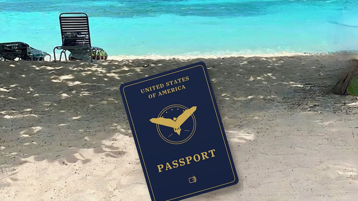 A US passport resting on the sand at a Virgin Islands beach with turquoise water behind