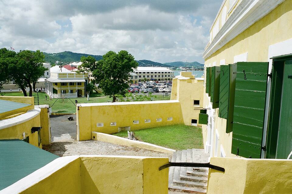 Inside Fort Christiansvaern, looking over its yellow walls to Christiansted and the harbour