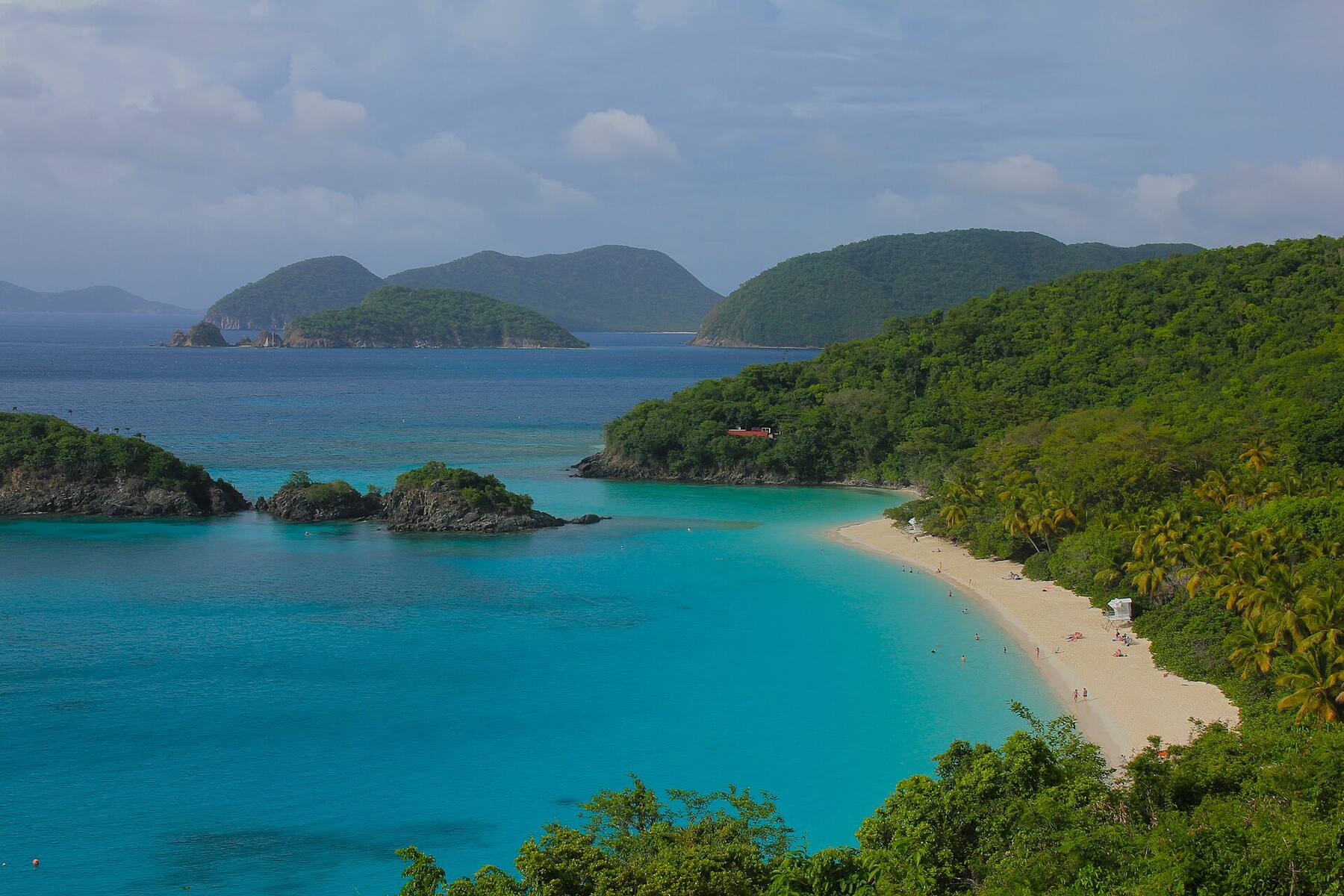 Trunk Bay, St. John, seen from the North Shore Road overlook — white sand, turquoise water and Trunk Cay