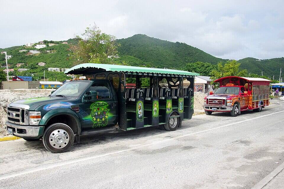 Open-air safari taxis waiting in Road Town