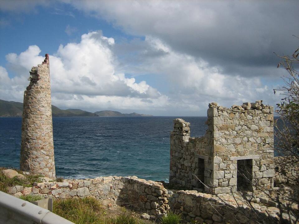 The stone chimney and ruined mine buildings at Copper Mine, above the sea on Virgin Gorda