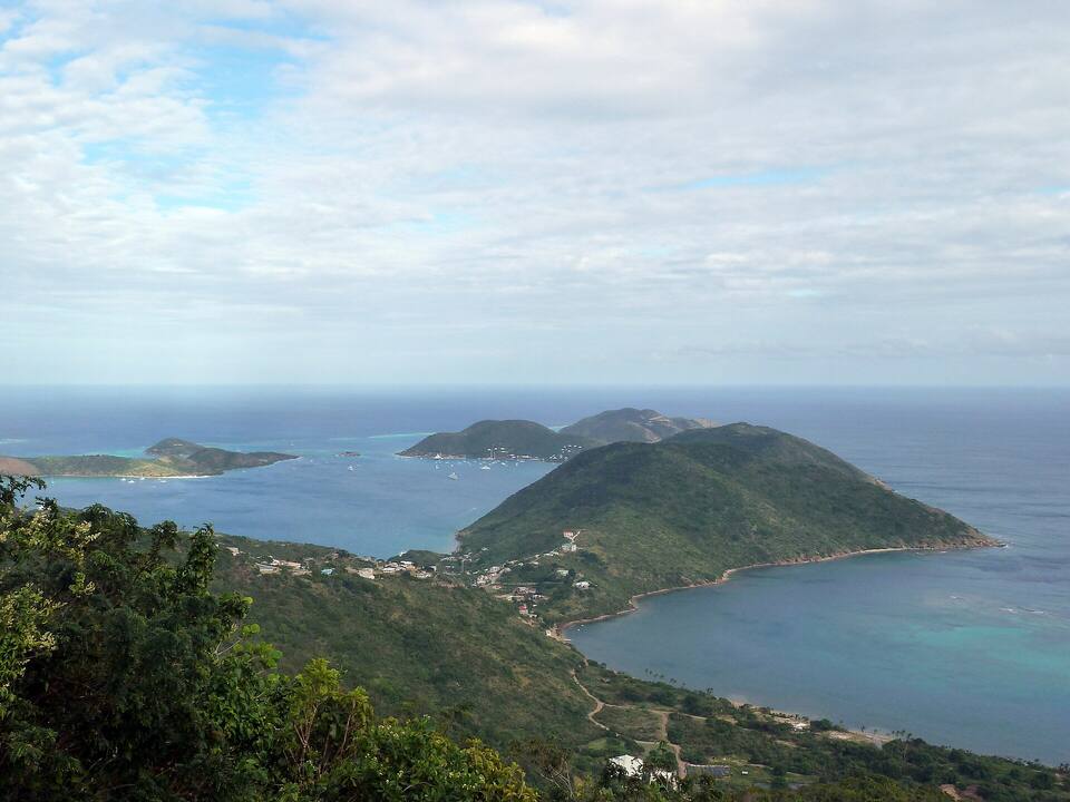 North Sound from the overlook on the North Sound road: the sound and its islands, the road winding down to the shore