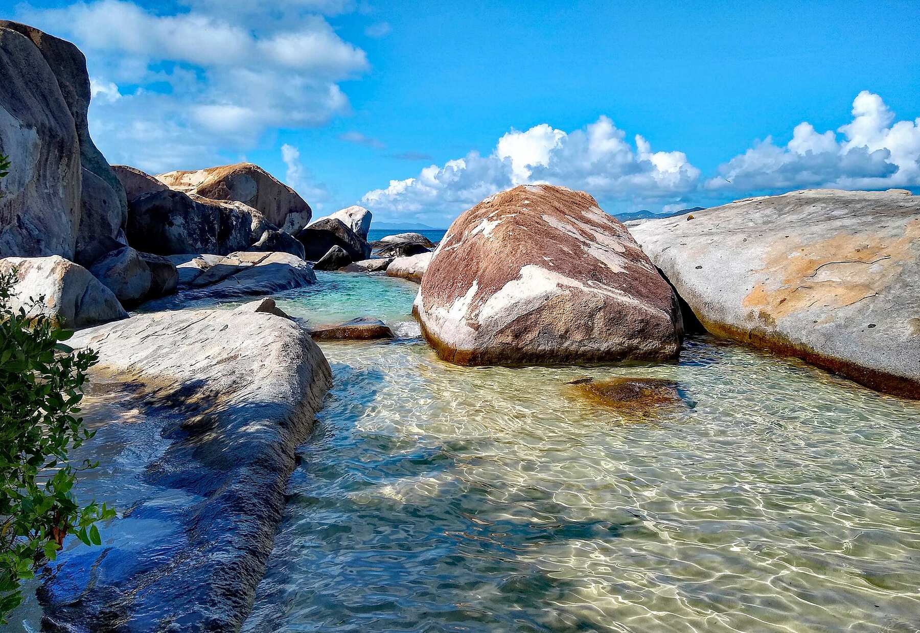 The Baths, Virgin Gorda: granite boulders around a clear tidal pool under a blue sky